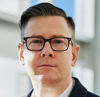 Alexander Hughes, CEO et dirigeant d’une entreprise de trading de cryptomonnaie, en portrait